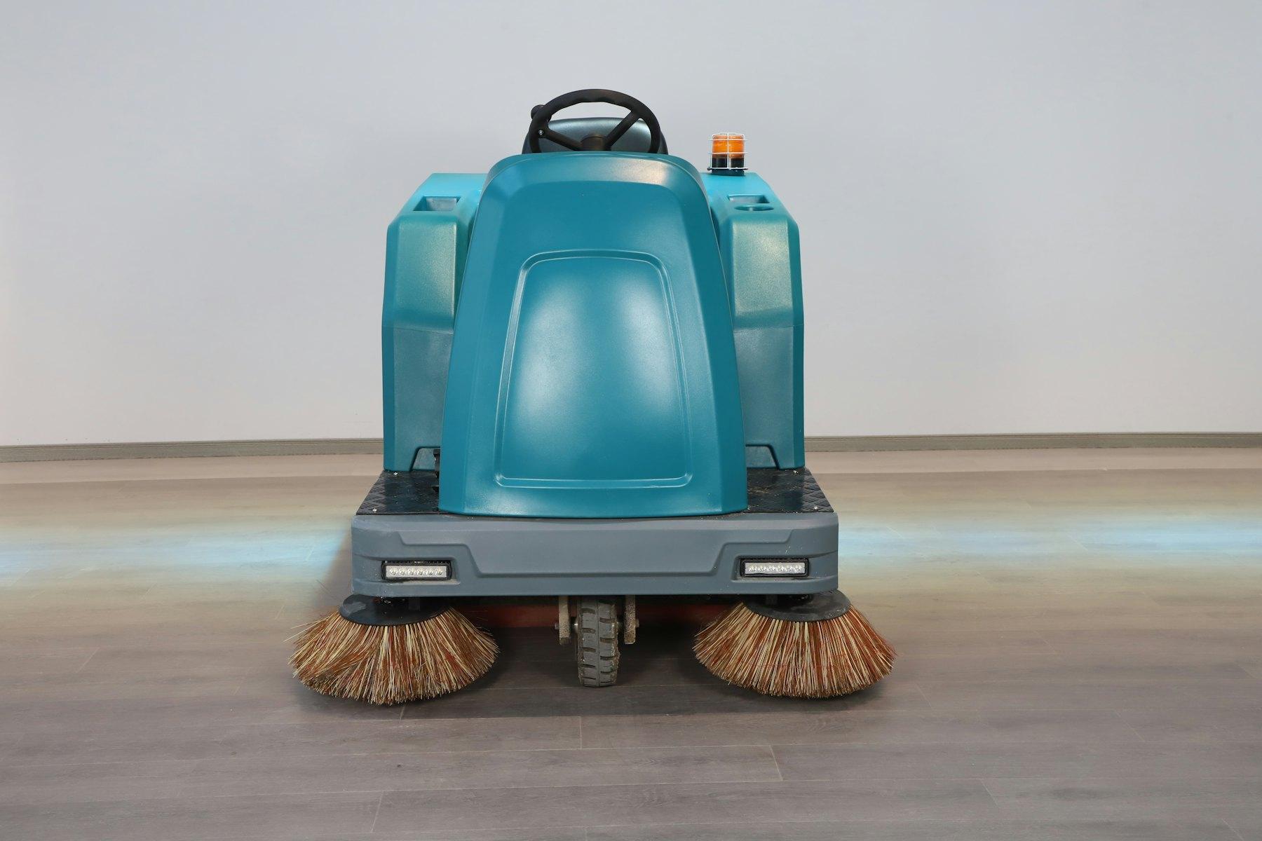 Industrial ride-on floor scrubber
